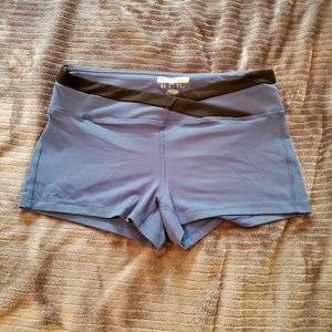 Blue compression shorts with criss cross